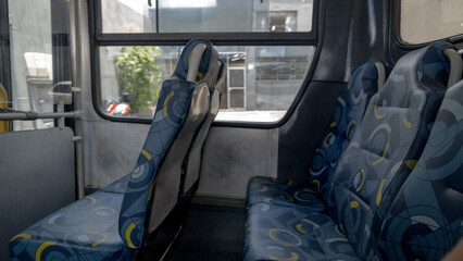 Inside the bus sitting at the back of public transport
