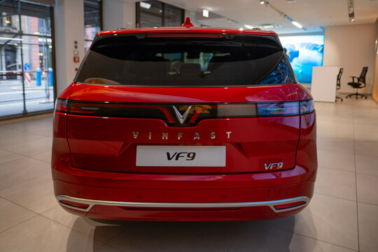 new red Vinfast vf 9 electric SUV in Studio, advanced technologies in vietnamese automotive industry, Environmental sustainability, Car dealerships, test drives, Berlin, Germany - February 17, 2024