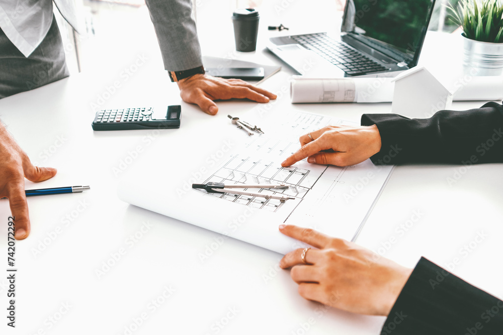 Poster architect and engineer working with construction drawing project on table in office. architecture an