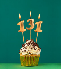 Birthday card with candle number 131 - Green background