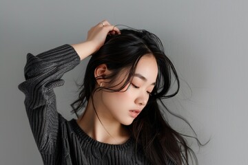Fototapeta premium seductive asian woman with a hand in her hair