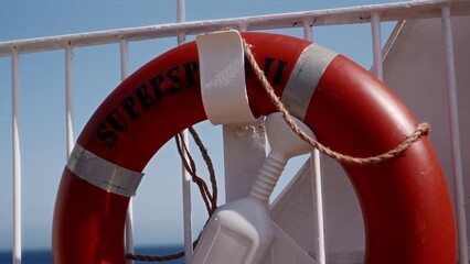Life Buoy Mounted On A Ferry's White Metal Railing