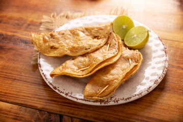 Pescadillas. So called when they are stuffed with fish such as tuna, popular during the Lent season. They are known as Golden Quesadillas when they are filled with ingredients such as meat or potatoes