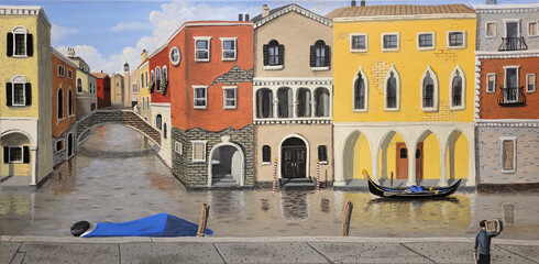 Early morning scene of colourful buildings that line the canals of Venice, Italy.  