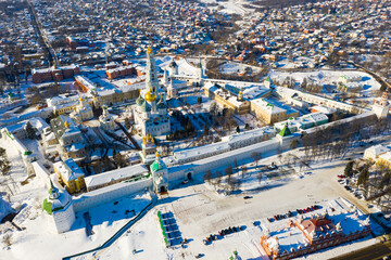 Scenic aerial view of architectural ensemble of Trinity Lavra of St. Sergius covered with snow in Russian town of Sergiev Posad..