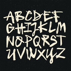 Vector handwritten calligraphic watercolor alphabet, white on black background. Hand drawn alphabet written with brush pen. Mayuscula – big letters.