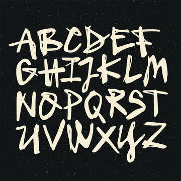 Vector handwritten calligraphic watercolor alphabet, white on black background. Hand drawn alphabet written with brush pen. Mayuscula &ndash; big letters.