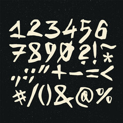 Vector handwritten calligraphic ink alphabet, numbers and symbols, white on black background. Hand drawn alphabet written with brush pen.