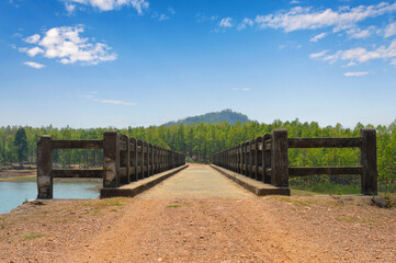 Bridge over the lake, near the mountain.