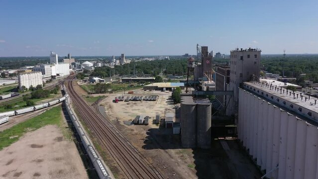 Afternoon view of aging grain elevators near the downtown skyline of Wichita, Kansas, USA.