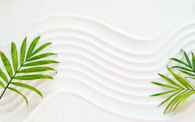 White sand and palm leaves