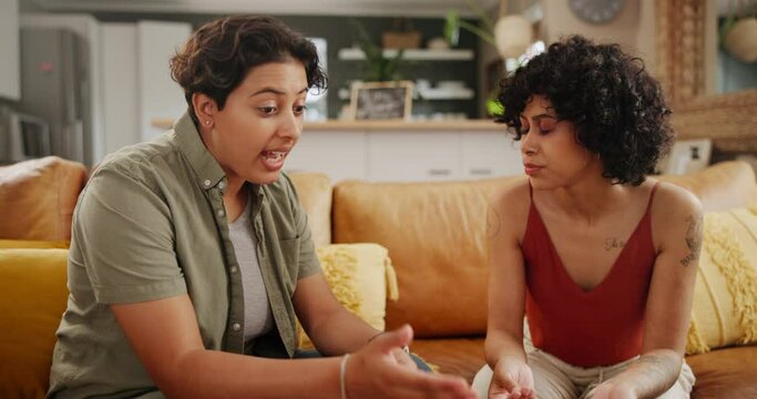 Woman, lesbian couple and conflict on sofa in fight, argument or confession in living room at home. Young female person, LGBTQ or gay people in disagreement, dispute or break up and divorce at house