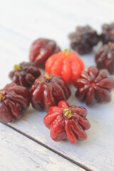 Bunch of ripe Surinam Cherry fruits on table 

