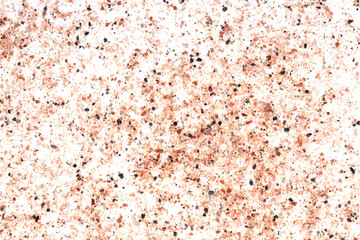 Black and pink volcanic salt on white background