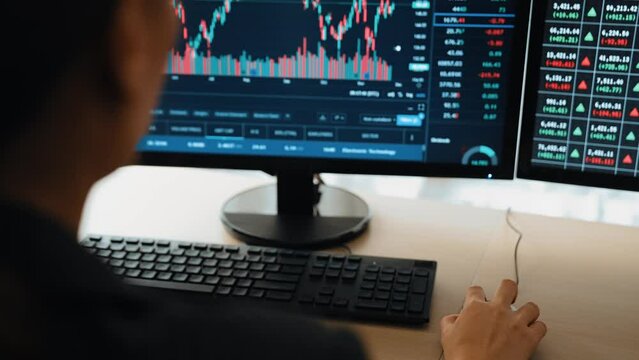 Business investor in stock trading company analyzing stock exchange marketing looking at monitors analyzing candle bar price for loss and grow up gain and profits. Burgeoning