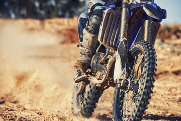 Closeup, dirt track and wheels of motorcyclist with motorbike for race, extreme sports or outdoor...