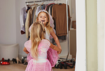 Girl, sister and face with fairy costume in bedroom of home for dress up, fantasy play and tiara...