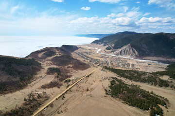 Spring landscape from the air to the countryside. Buguldeika village on the shore of Lake Baikal,...