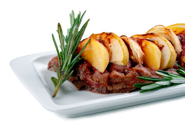 Steak with chopped apples and cinnamon in a blue plate on a white background. Festive dish with beef