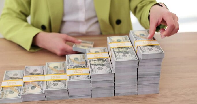 Stack of growing dollars on stairs in office