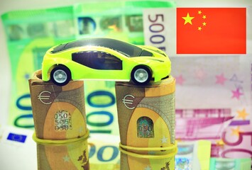 Modern car over Euros banknotes . Concept of cars in China or Chinese car industry.