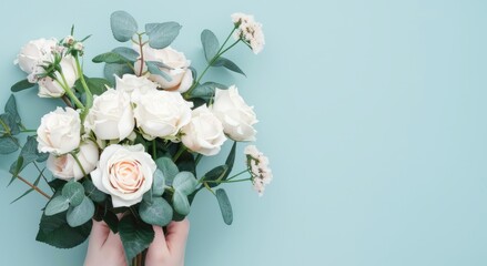 Elegant Handcrafted Floral Arrangement With Lush White Roses and Greenery on a Pastel  Background