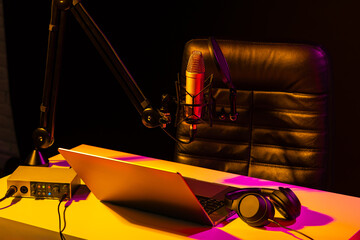 Home studio podcast interior. Microphone, table and chair