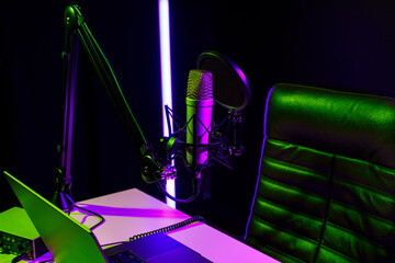 Home studio podcast interior. Microphone, table and chair