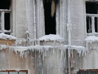 House facade after fire in winter everything frozen in Kazan, Russia.
