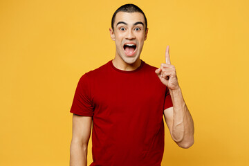 Young smart proactive middle eastern man he wear red t-shirt casual clothes holding index finger up...
