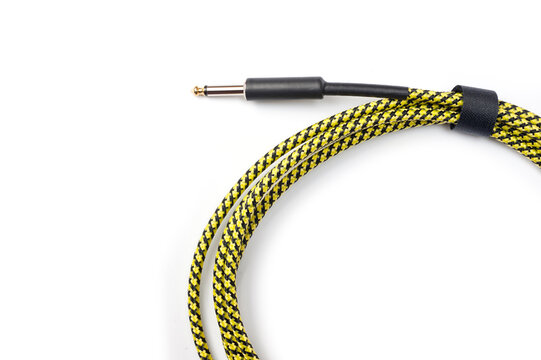 Jack cord for guitar and connection of various musical devices, pedals, amplifier and so on. - Powered by Adobe