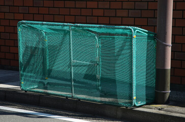 Garbage containers at public garbage collection points along outdoor roads in Japan