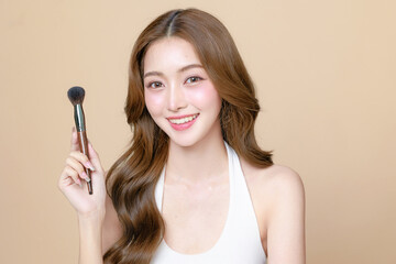 Young Asian beauty woman curly long hair with korean makeup style touch her face and perfect skin...