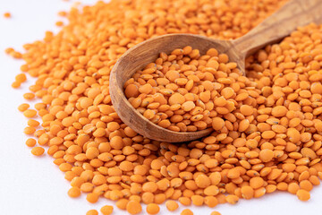 Red lentils pile isolated.Pile lentil isolated on white background.