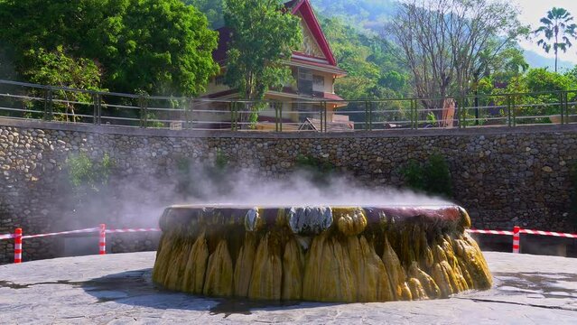 the main hot spring at Ranong mineral hot spring Ranong hot spring landmark of Ranong .province Thailand.Hot spring pool and seating for visitors to soak their feet .in the hot spring pool to relax.