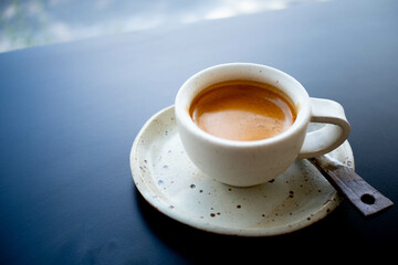 A Ceramic Cup of Espresso Double shot coffee on the table