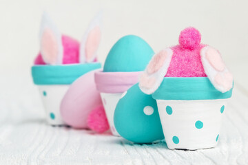 Cute Easter decorations, the bunny in the flower pot and handmade Easter eggs