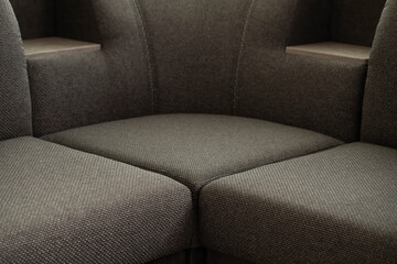 Sofa with shelves. The seat part of upholstered comfortable furniture for relaxation is covered...