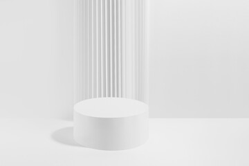 One white round podium with striped column as geometric decor, mockup on white background. Template for presentation cosmetic products, gifts, goods, advertising, design in modern style.