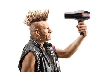 Punk with a mohawk using a hair dryer