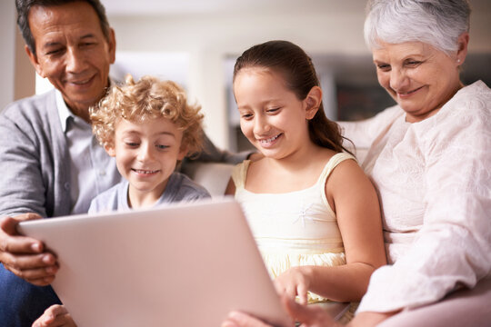 Happy Family, Grandparents And Children With Laptop For Communication, Entertainment Or Research On Sofa At Home. Grandma, Grandpa And Kids Smile On Computer For Online Search Or Networking At House