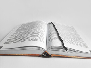 a thick book with its middle page open