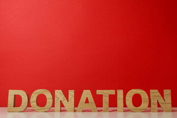 The word donation on a red background.