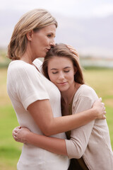 Mother, daughter and hug with care outdoors in nature for mothers day, love and affection for gratitude. Mom, teenage child and bonding together on summer vacation for support, smile and relationship