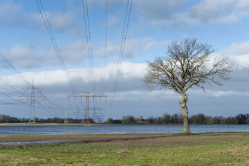 Flooded meadows with electricity pylons in the Altmark, Saxony-Anhalt, Germany