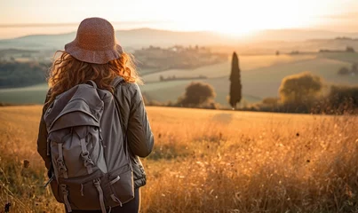 Foto op Plexiglas Tuscan Serenity: Against the Backdrop of a Tuscan Sunset, a Woman Tourist Walking at the Lush Fields, Captivated by Tuscany's Timeless Splendor.   © Mr. Bolota