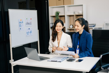 Portrait of success business people working together in office. Couple teamwork startup concept.