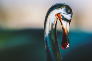glass figurine made of glass in the shape of a flowing swan