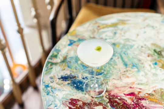 Close-up of a martini cocktail on a table in a bar