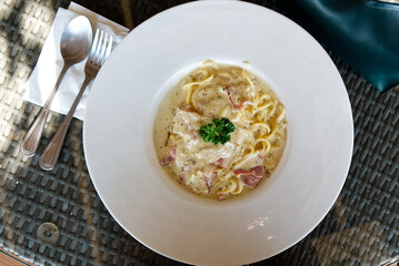 A Freshly Prepared and Delicious Spaghetti Carbonara Served on the Dining Table